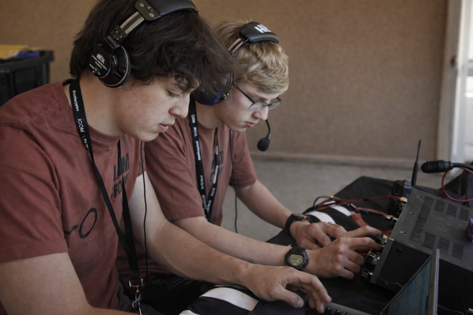 Two young radio operators working together at a station.